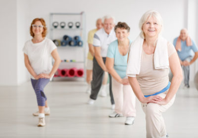 Elderly,People,Exercising,In,A,Group,In,Fitness,Club