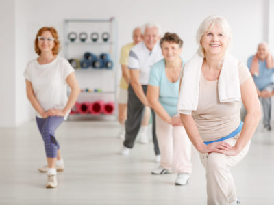 Elderly,People,Exercising,In,A,Group,In,Fitness,Club
